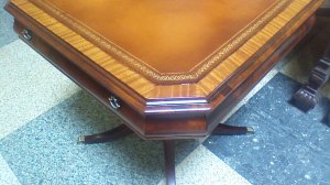 close up of the leather and feather mahogany end tables